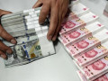 سعر اليوان الصيني يتراجع مقابل الدولار