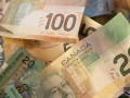 زوج الدولار كندي يصحح من قمم عام وينزلق أدنى مستوى 1.3300